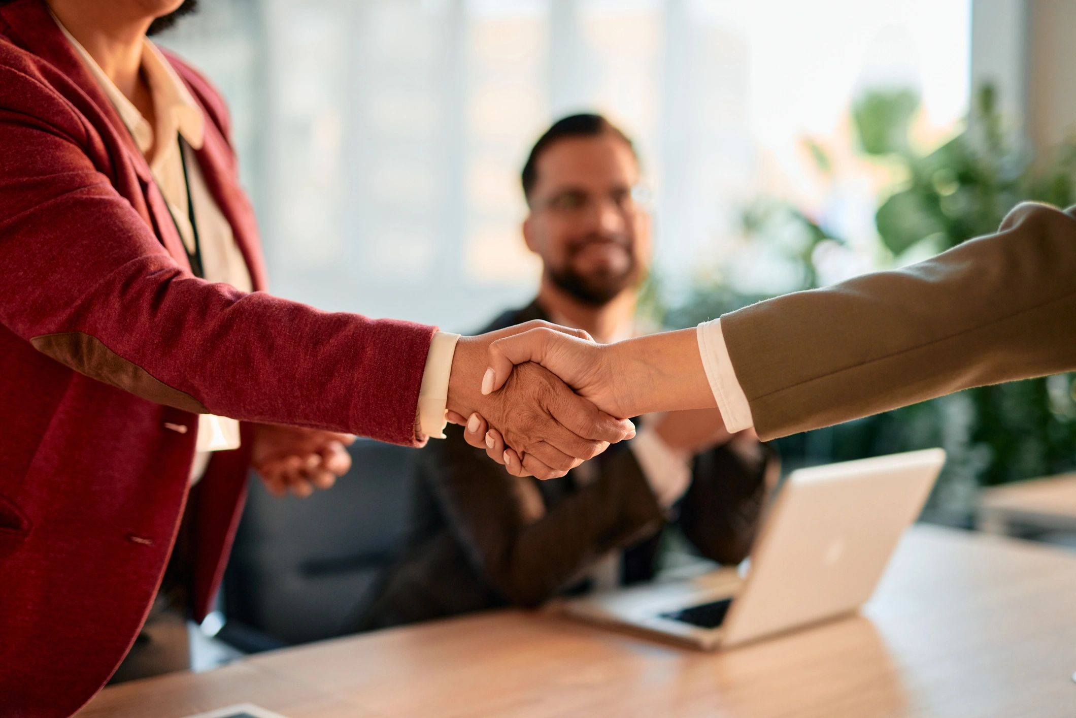 Business partnership handshake
